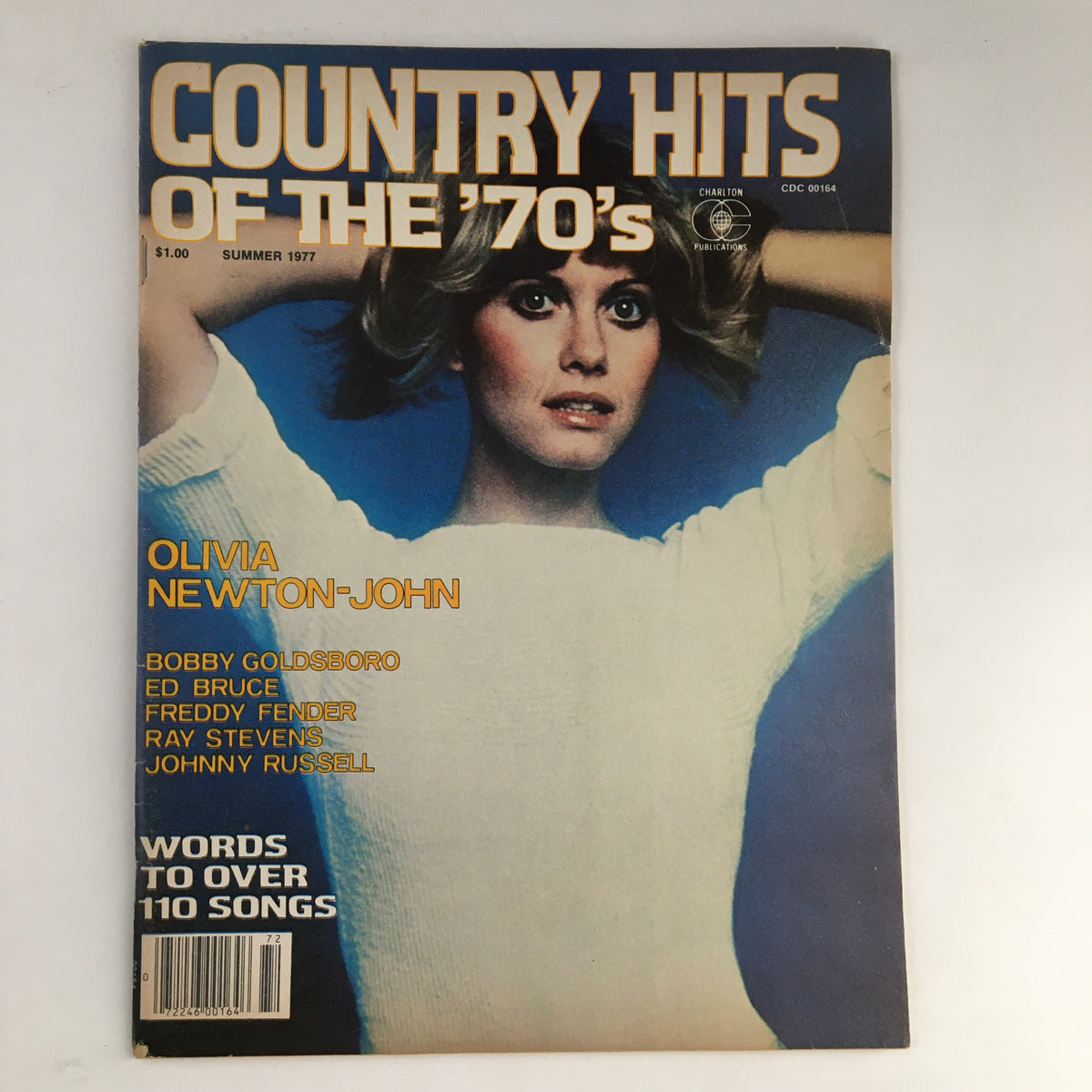 Cover of 'Country Hits of the Seventies Summer 1977' featuring Olivia Newton-John. The magazine showcases popular country artists and songs from the 1970s.