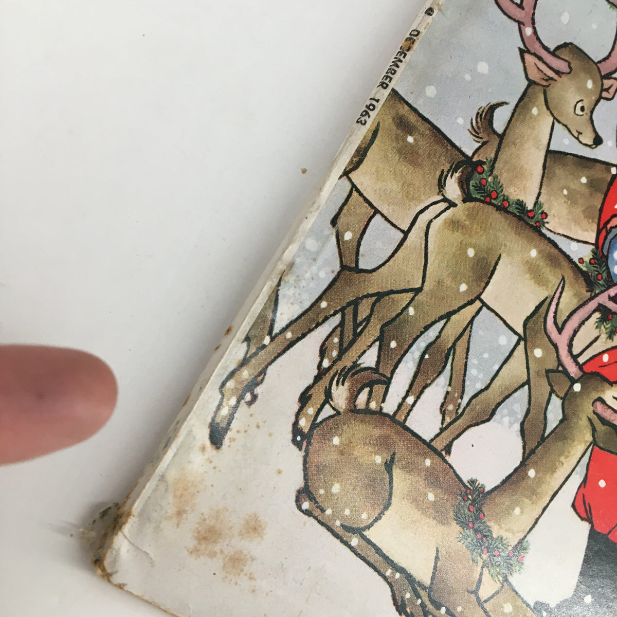 Close-up of the Family Circle Magazine December 1963 cover showing reindeer and Santa Claus. The image highlights the vintage charm and holiday theme.