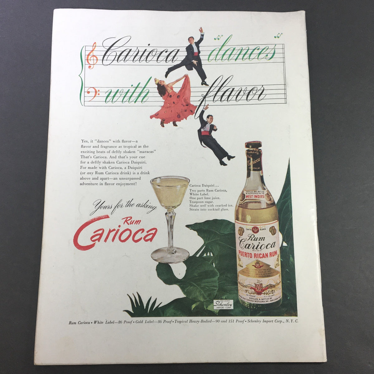 Advertisement for Rum Carioca from July 1946 issue of VTG Gourmet The Magazine of Good Living, showcasing a cocktail and dancers with a vibrant design.