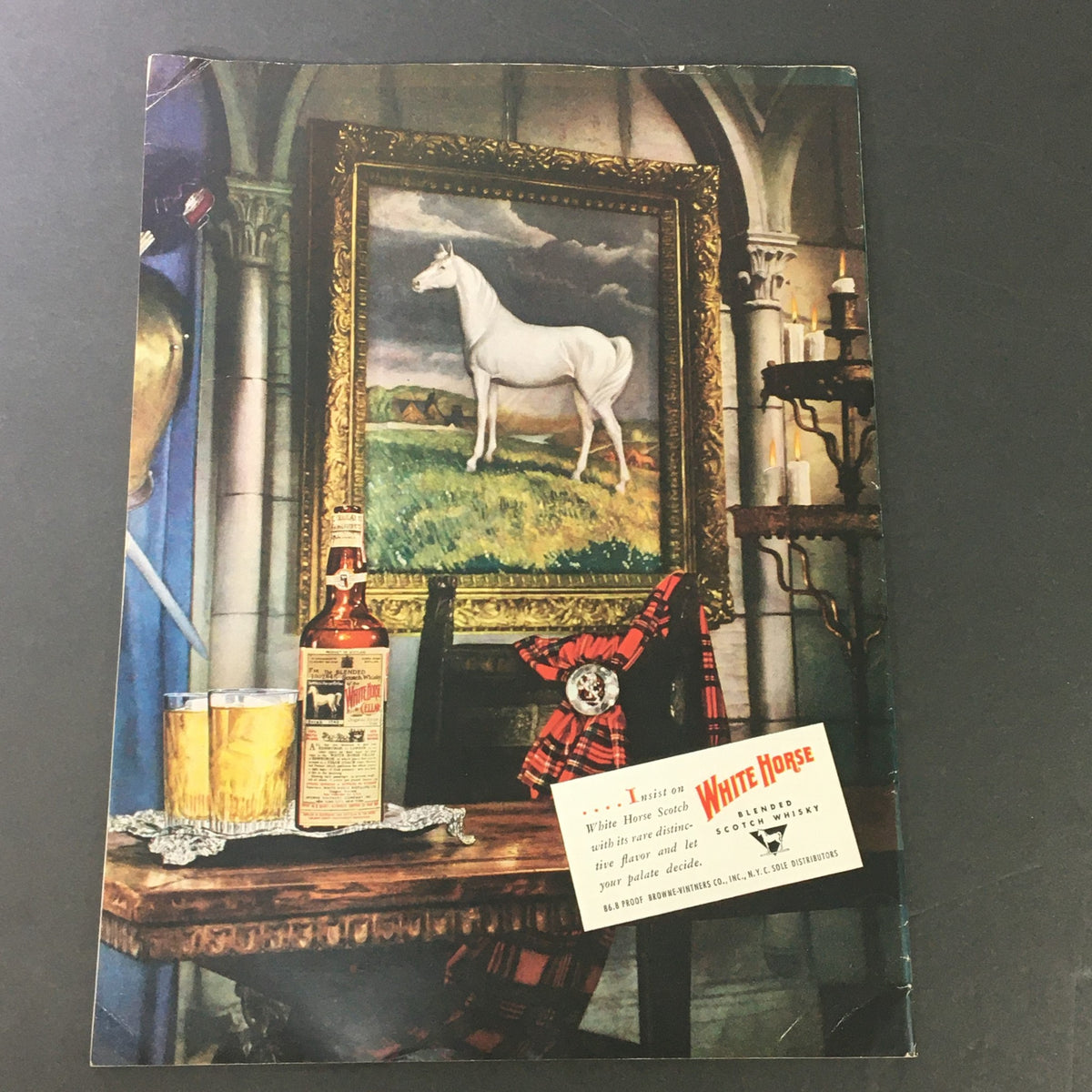 Cover of VTG Gourmet The Magazine of Good Living September 1949 featuring a picturesque scene with a white horse painting, two glasses of whiskey, and a vintage advertisement for White Horse Scotch whisky.