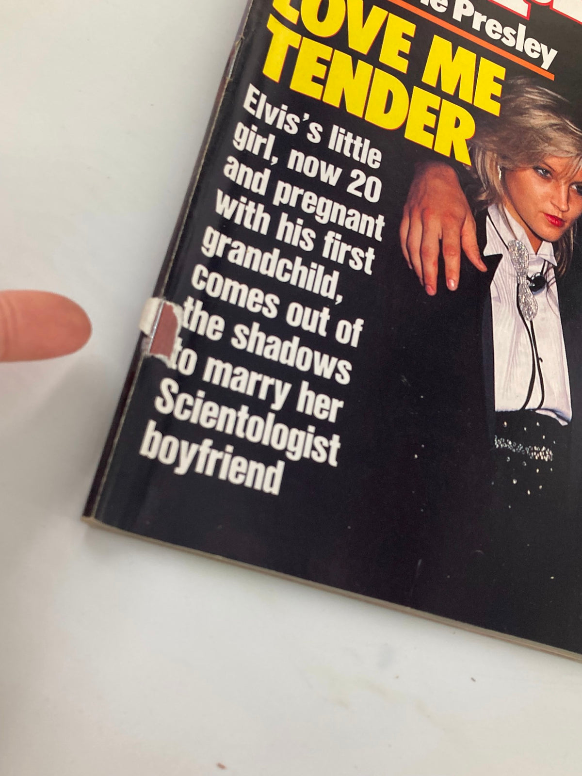 Close-up of the People Weekly Magazine cover from October 24, 1988, focusing on the text 'LOVE ME TENDER' and a small tear in the binding, highlighting the vintage condition of the magazine.