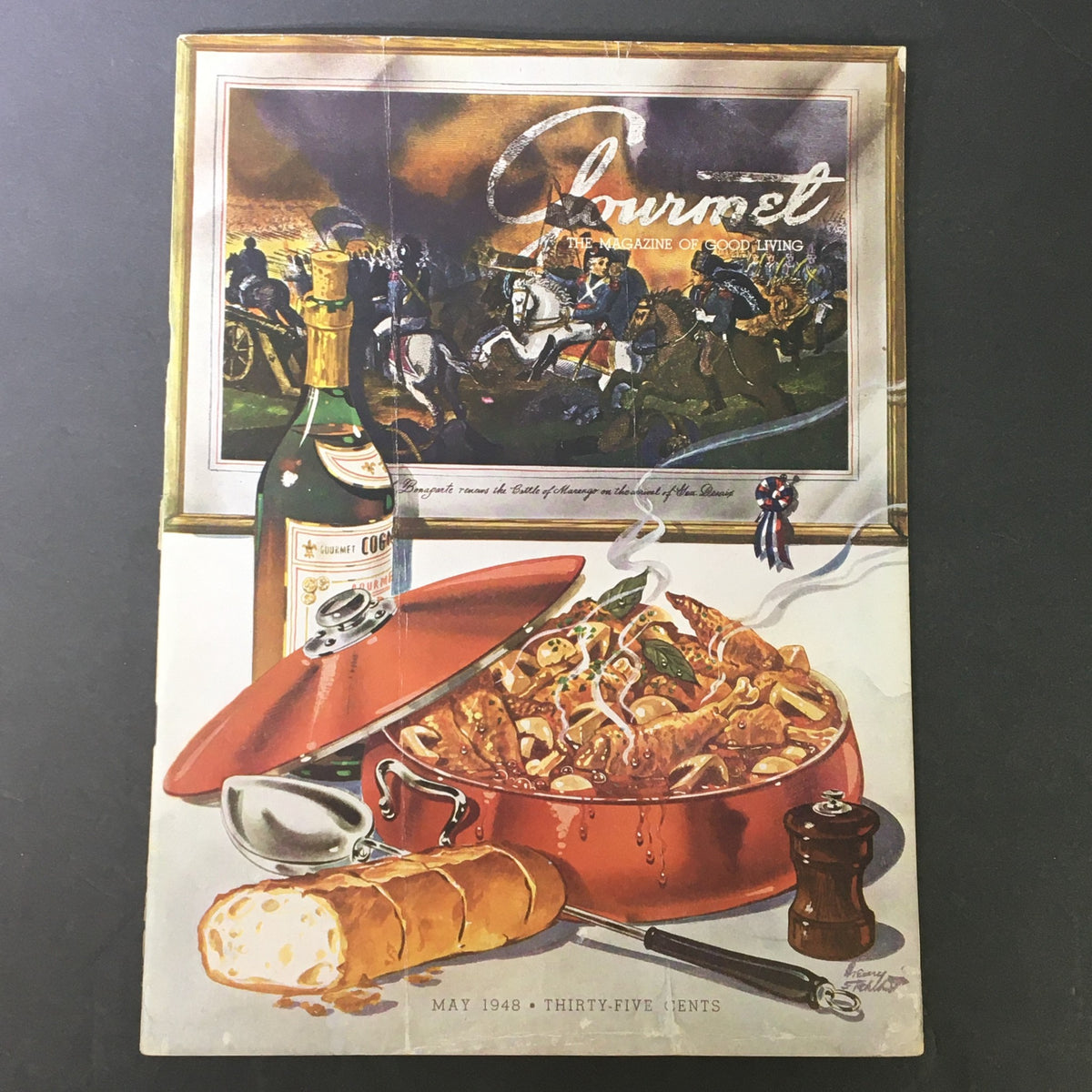 Cover of VTG Gourmet The Magazine of Good Living May 1948 featuring an appetizing dish in a red pot, a bottle of gourmet liquor, and a loaf of bread against a backdrop of historical figures.