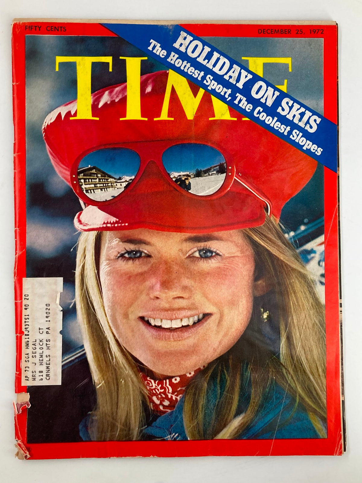 Vintage Time Magazine cover from December 25, 1972, featuring the title 'Holiday On Skis: The Hottest Sport, The Coolest Slopes' with a smiling woman wearing a red hat and sunglasses. The magazine represents winter sports culture.