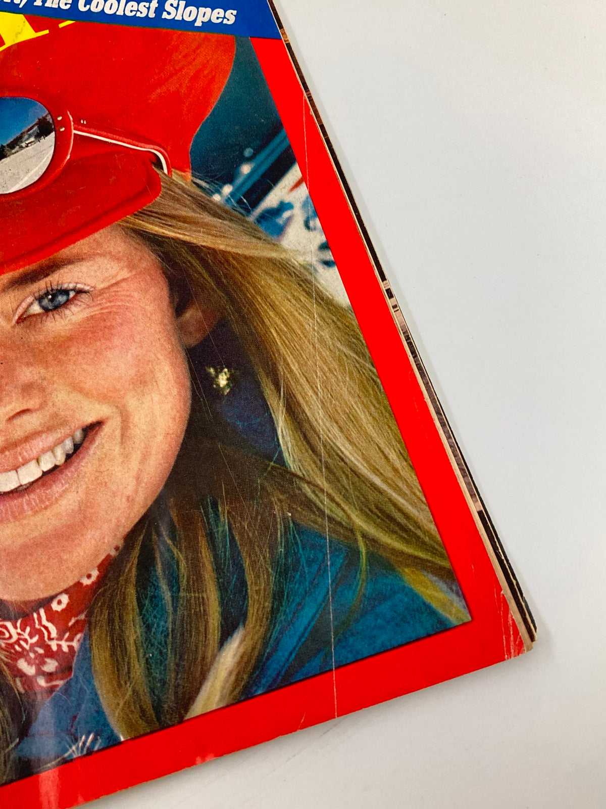 Close-up of a smiling woman wearing a red hat and sunglasses on the cover of the VTG Time Magazine December 25, 1972, featuring the theme 'Holiday On Skis: Hottest Sport & Coolest Slope.'