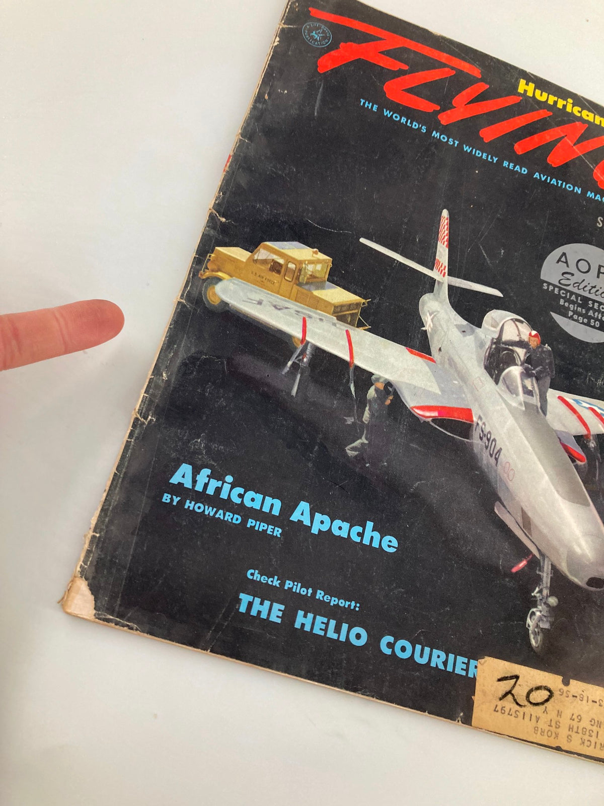 Close-up view of the VTG Flying Magazine September 1955 cover highlighting the Republic RF-84F aircraft, with a finger pointing towards the African Apache article.