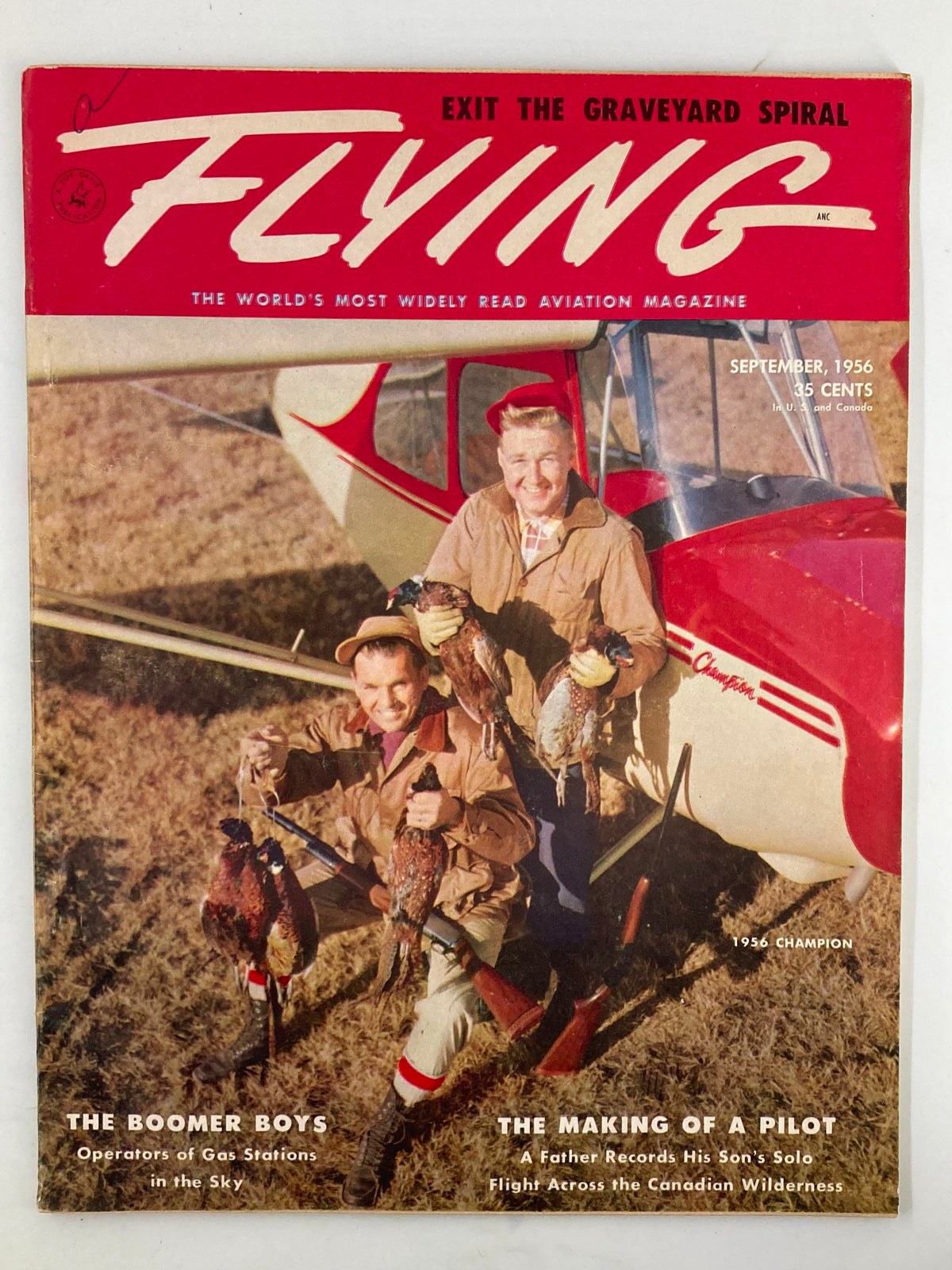 Cover of VTG Flying Magazine September 1956 titled 'The Boomer Boys', featuring two men holding ducks in front of a 1956 Champion aircraft.