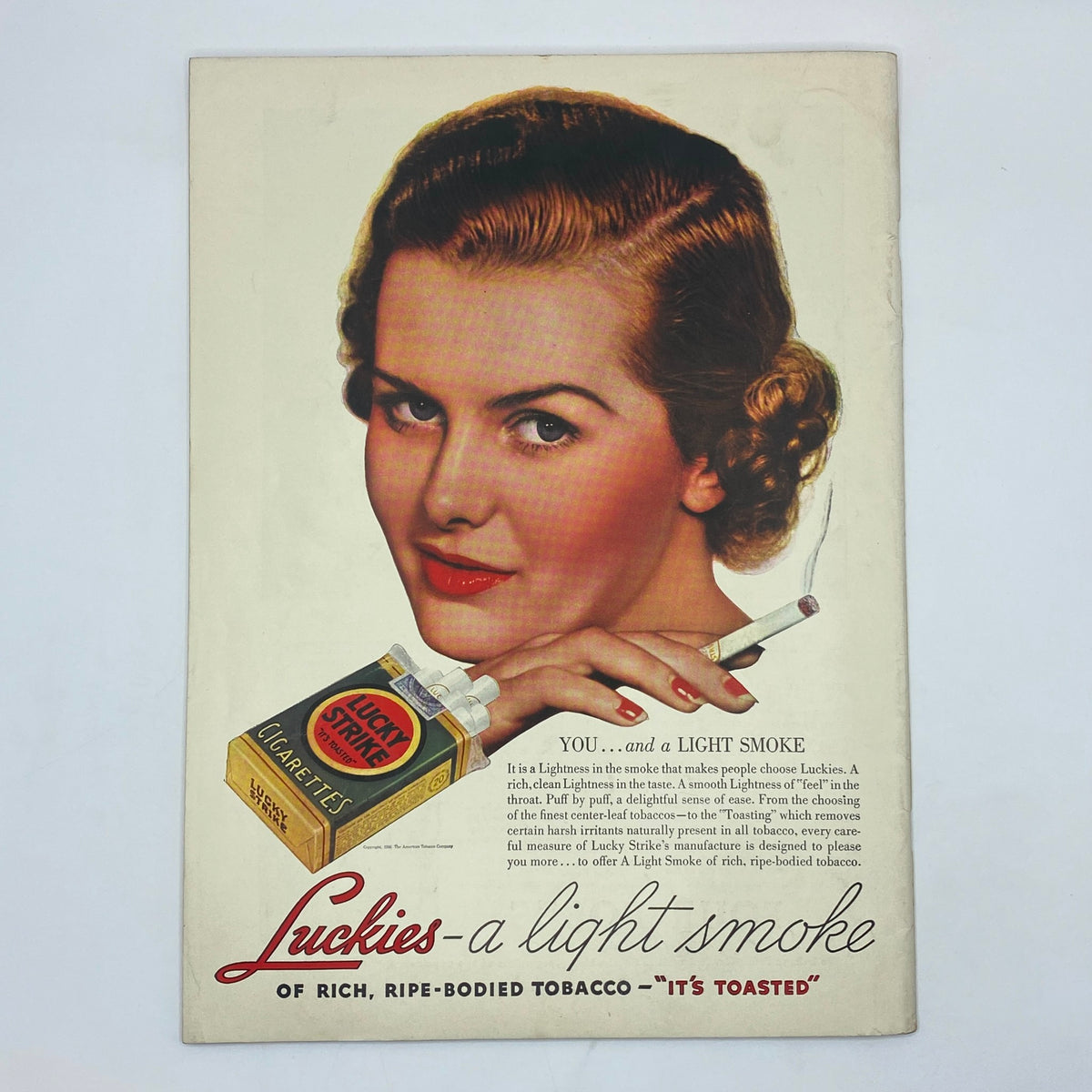 Vintage cigarette advertisement from The New Yorker magazine, October 24, 1936, featuring a glamorous woman promoting Lucky Strike cigarettes with a classic beauty look.