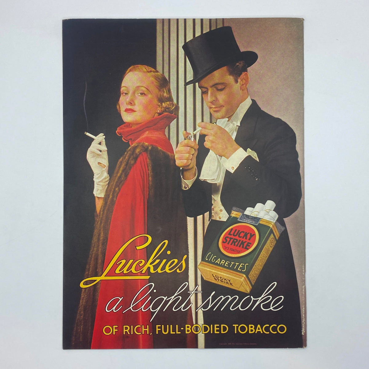 Vintage advertisement from The New Yorker magazine February 1, 1936, promoting Lucky Strike cigarettes, depicting a glamorous couple enjoying a smoke.