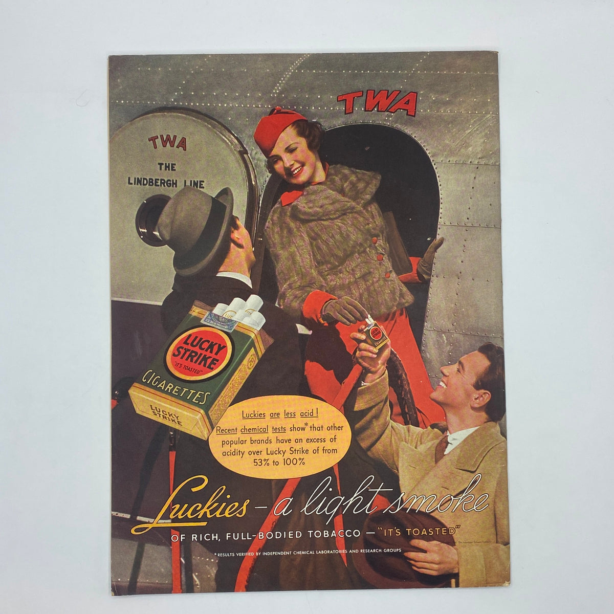 The New Yorker Complete Magazine March 28, 1936 Perry Barlow Cover featuring vintage cigarette advertisement for Lucky Strike, depicting a friendly interaction between a stylish woman in a red hat and two men, styled as a 1930s airline promotion.