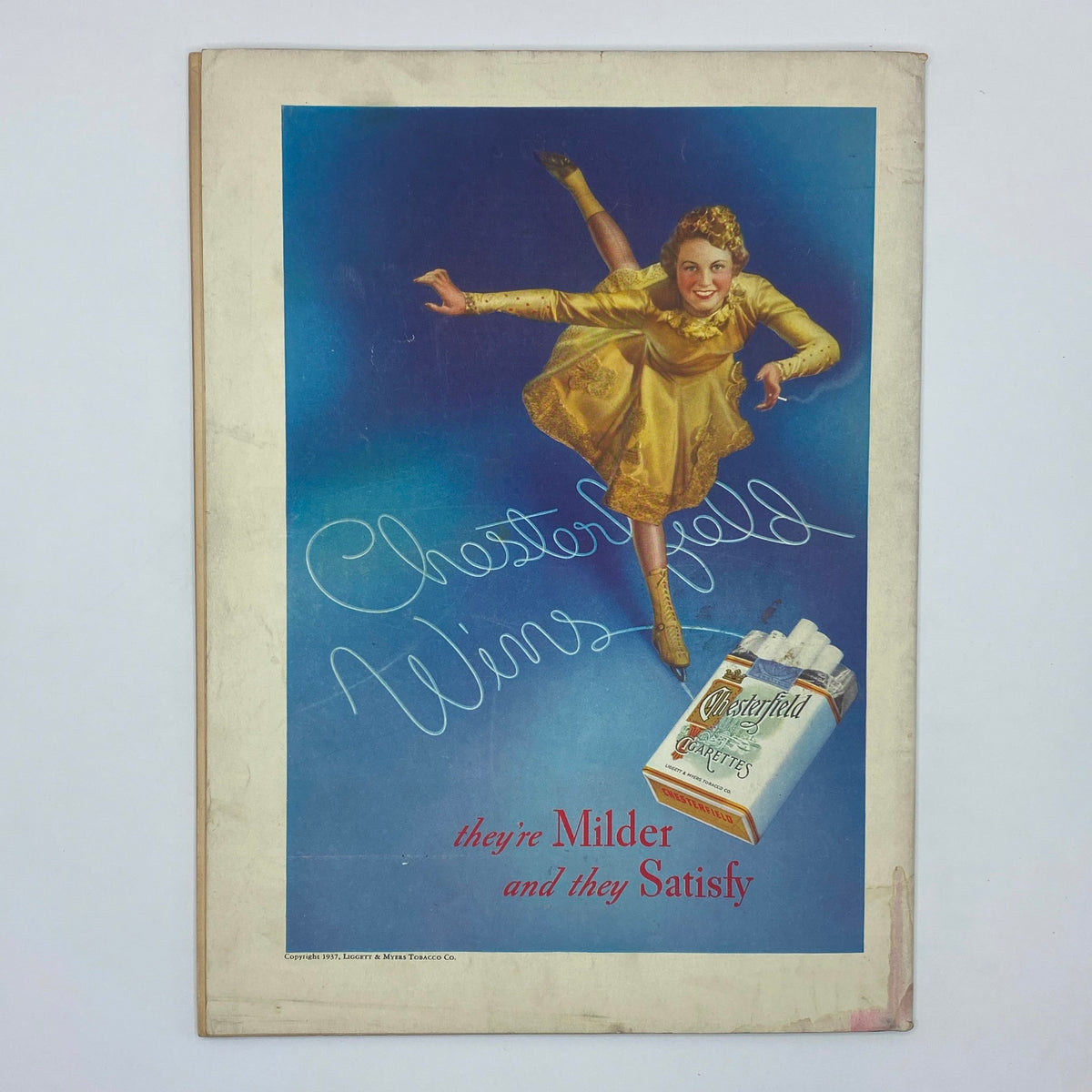 Chesterfield cigarette advertisement from The New Yorker Magazine January 9, 1937 featuring a figure skating woman in a gold dress promoting the brand.