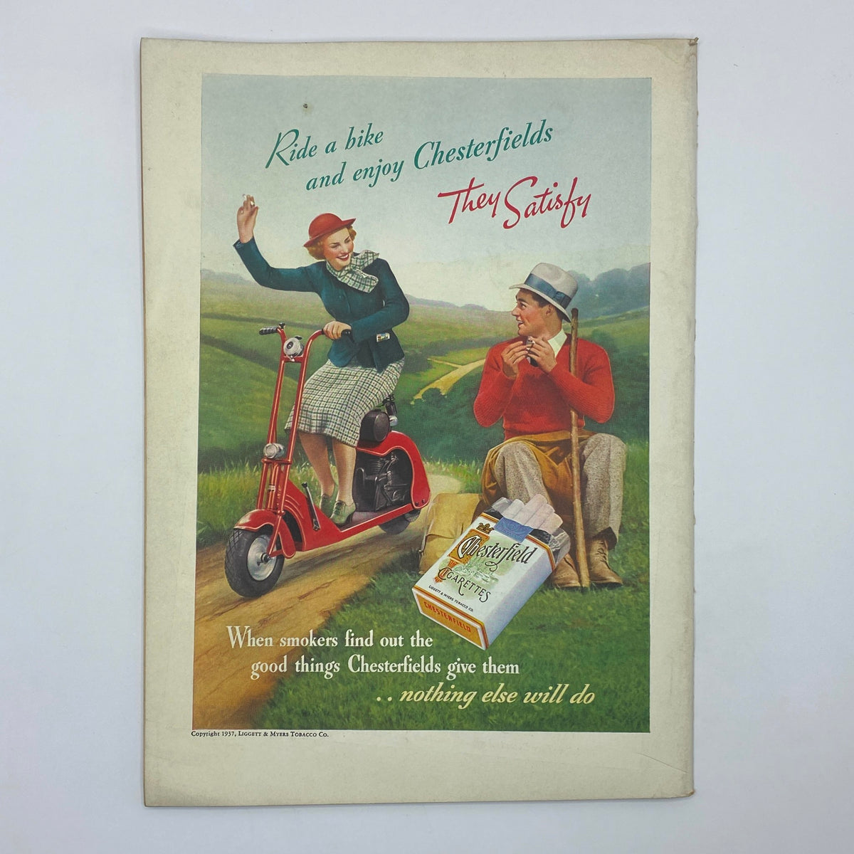 Vintage advertisement from The New Yorker April 3, 1937 for Chesterfield cigarettes, featuring a couple enjoying a bike ride in a picturesque landscape.