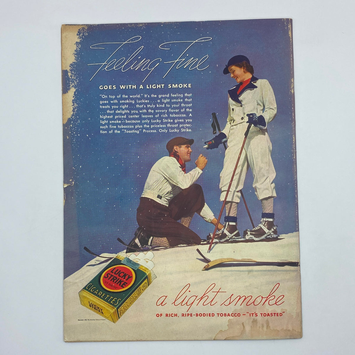 Vintage Lucky Strike cigarette advertisement in The New Yorker magazine from January 2, 1937, featuring a skier duo, promoting the product with a scenic snowy backdrop.
