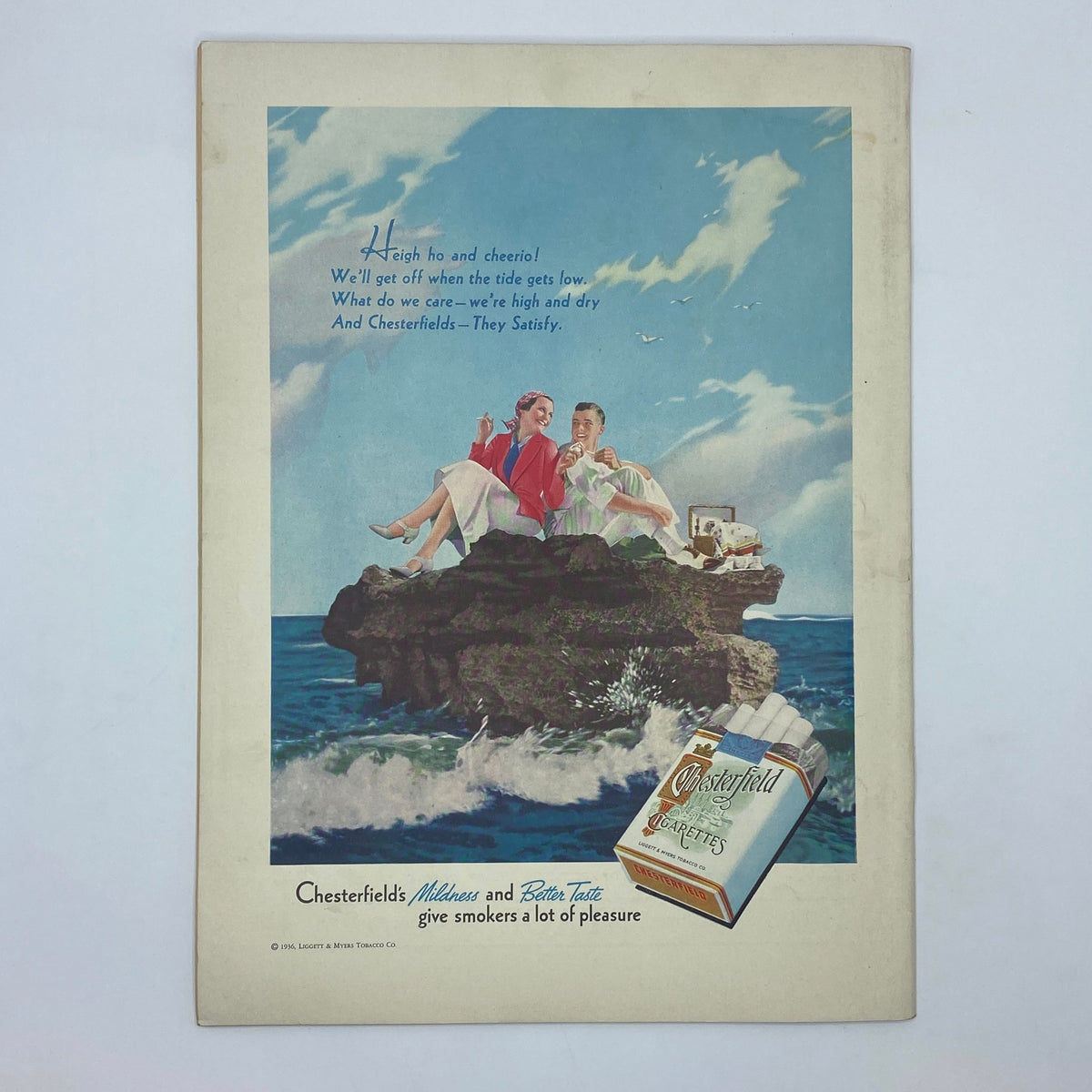 Chesterfield cigarettes advertisement from The New Yorker magazine July 4, 1936 depicting two stylish people enjoying a carefree moment by the sea, emphasizing the brand's appeal and slogan.