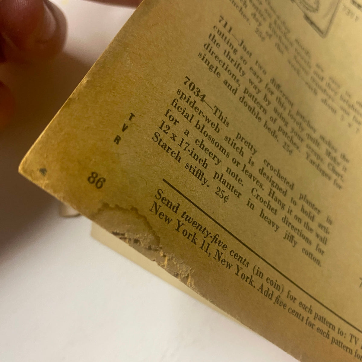 Close-up of the bottom edge of TV Radio Mirror Magazine March 1958, highlighting signs of wear and acceptable condition with a torn corner.