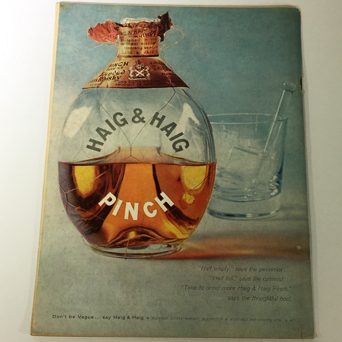 Cover of VTG Gourmet: The Magazine of Good Living - April 1958 featuring a vintage advertisement for Haig & Haig Pinch whisky. The image shows the whisky bottle with a cracked label and a glass in the backdrop, embodying mid-20th century design. Perfect for collectors of vintage magazines.