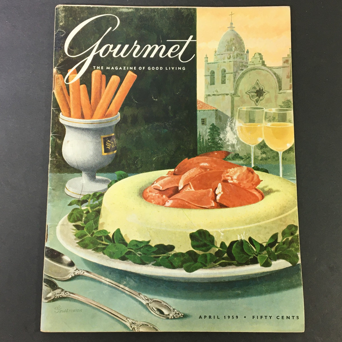 VTG Gourmet The Magazine of Good Living April 1959 magazine cover featuring a gourmet dish with lobster, surrounded by decorative elements and culinary accessories.