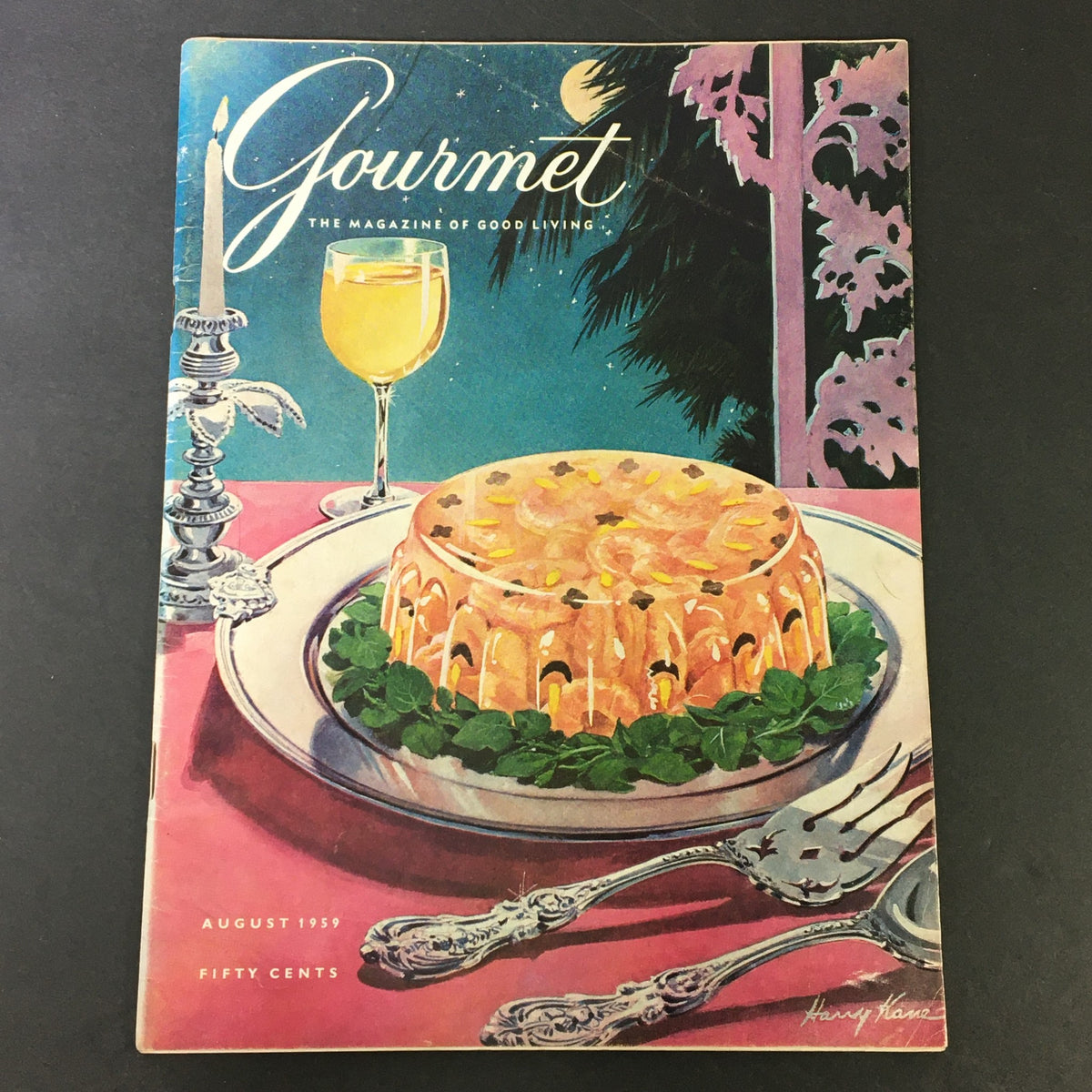 VTG Gourmet The Magazine of Good Living, August 1959 cover featuring a colorful dessert and a glass of beverage, showcasing vintage culinary art.