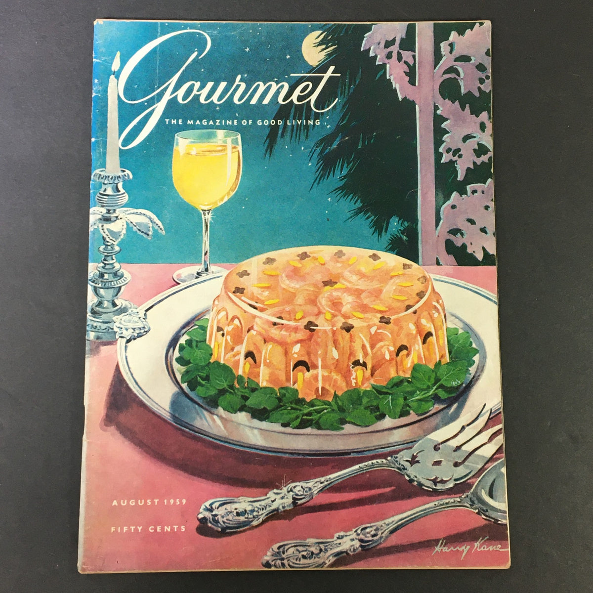 Cover of VTG Gourmet: The Magazine of Good Living, August 1959 featuring a colorful illustration of a jelly dish and a glass of yellow drink on a table.