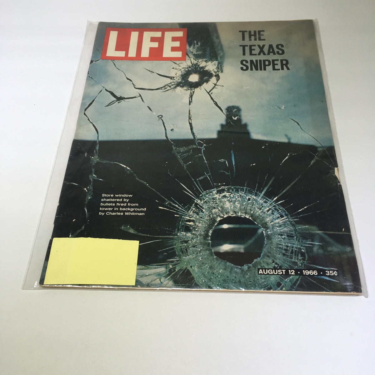 Cover of Life Magazine, August 12, 1966, featuring 'The Texas Sniper' with bullet hole imagery and the impact of bullets fired from a tower in the background.