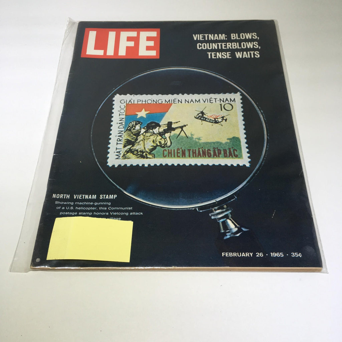 VTG Life Magazine February 26 1965 cover featuring a North Vietnam stamp depicting a machine gun scene, showcasing historical context of the Vietnam War.