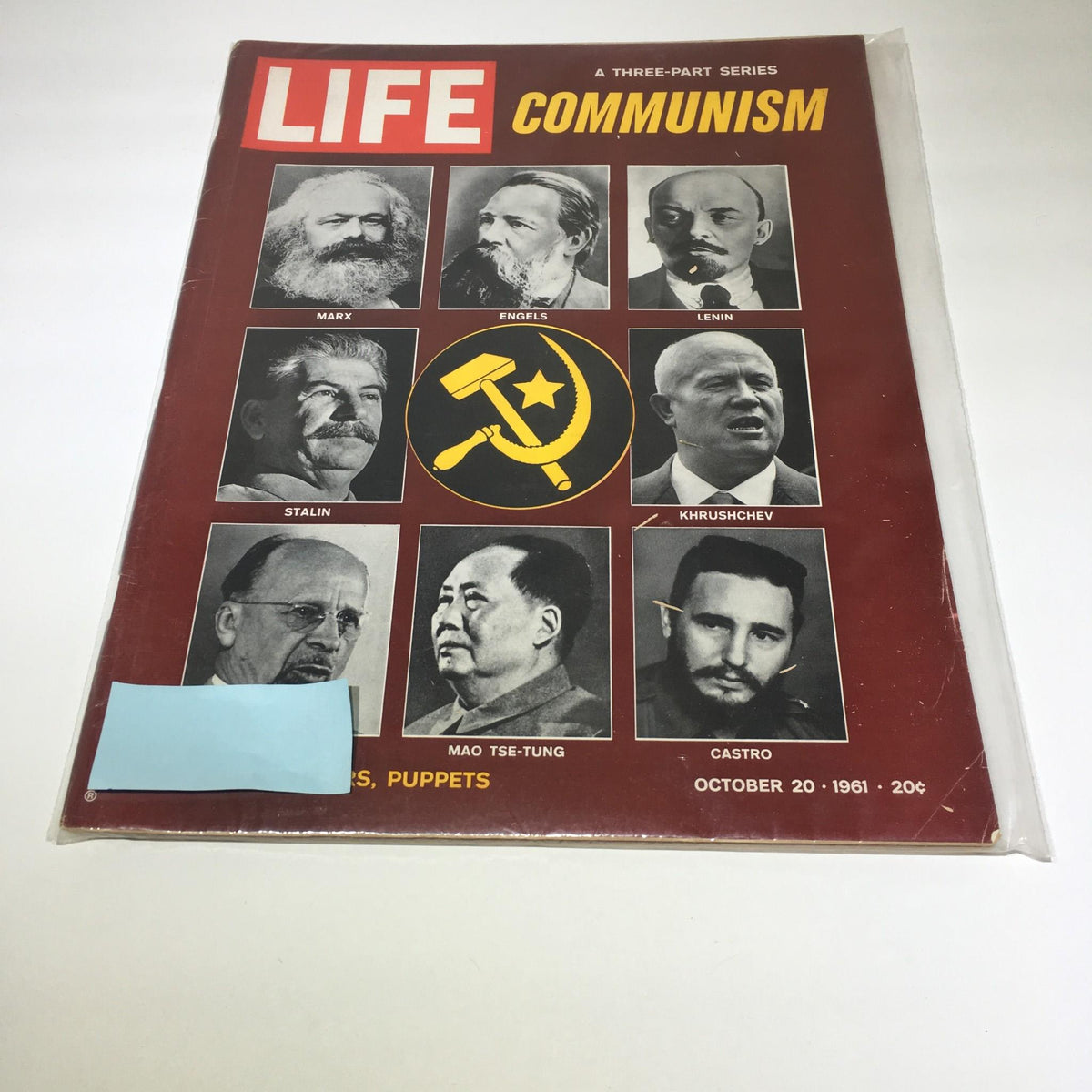 Front cover of the VTG Life Magazine from October 20, 1961, featuring a three-part series titled 'Faces of Communist Leaders'. The cover showcases prominent communist figures including Marx, Engels, Lenin, Stalin, Khrushchev, Mao Tse-Tung, and Castro against a striking red background with the title 'COMMUNISM' and includes imagery of a hammer and sickle.