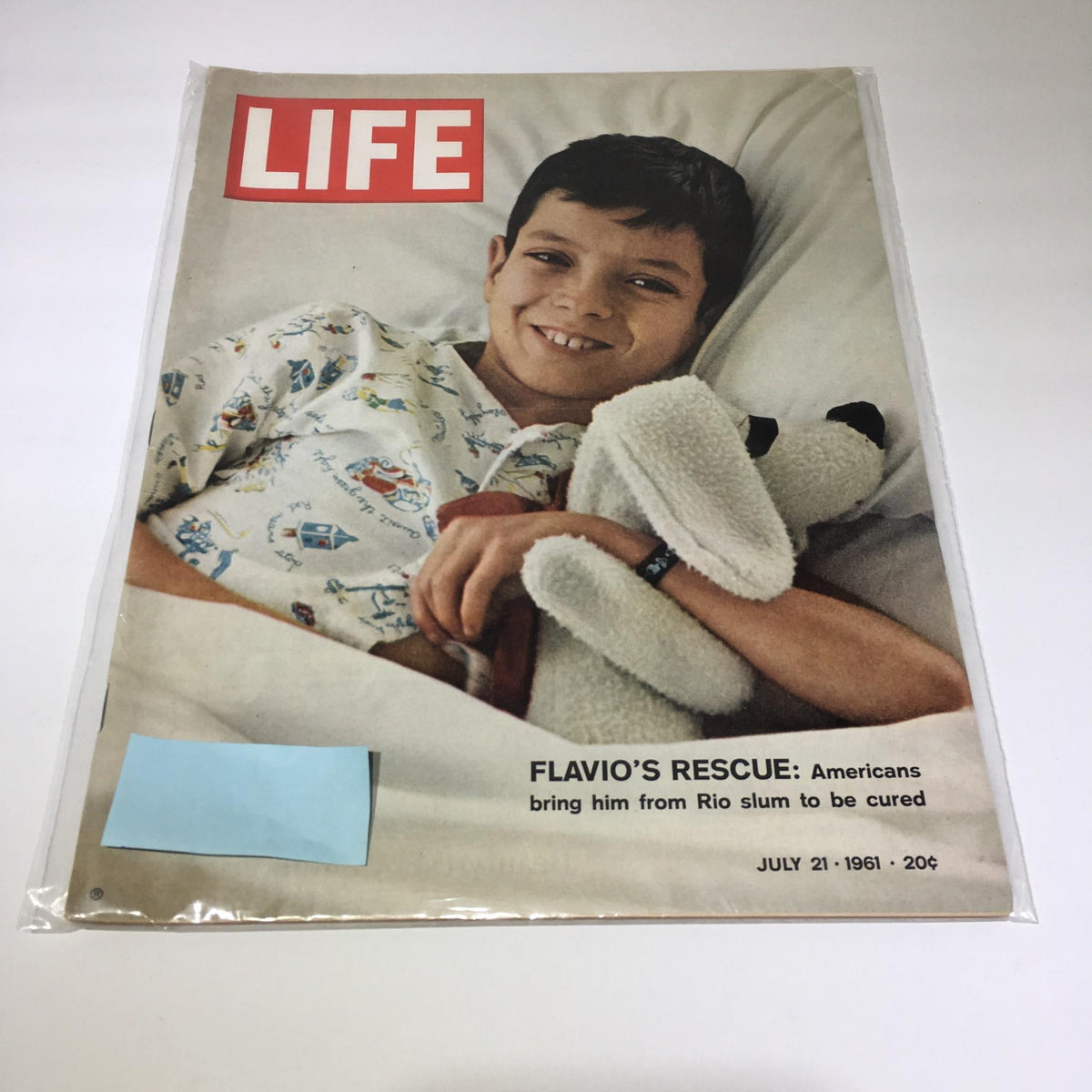 Vintage Life Magazine cover from July 21, 1961, featuring the story 'Flavio's Rescue: Americans bring him from Rio slum to be cured,' showcasing a young boy smiling while holding a stuffed animal.