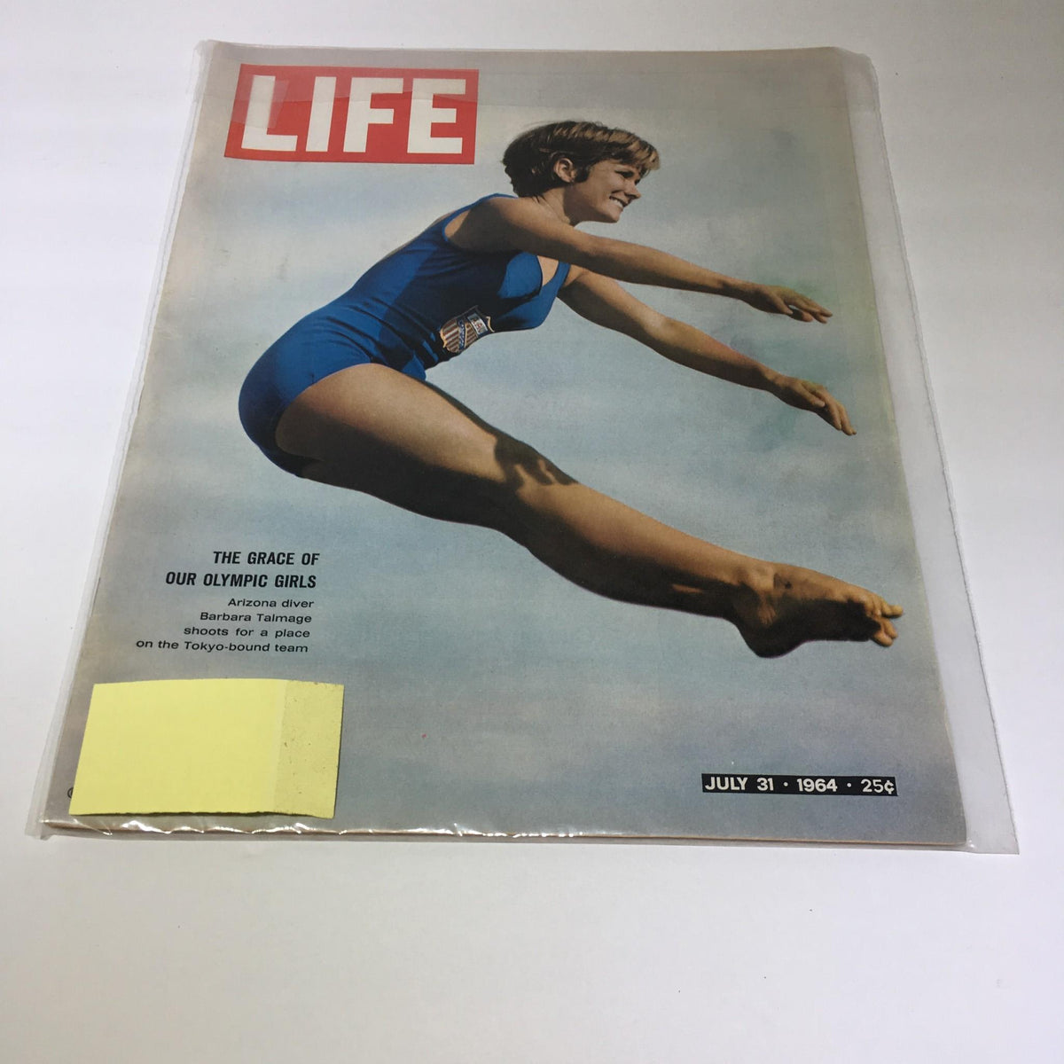 Cover of the VTG Life Magazine, July 31, 1964, featuring Olympian Barbara Talmage in mid-air during a dive, showcasing the theme 'The Grace of Our Olympic Girls'.