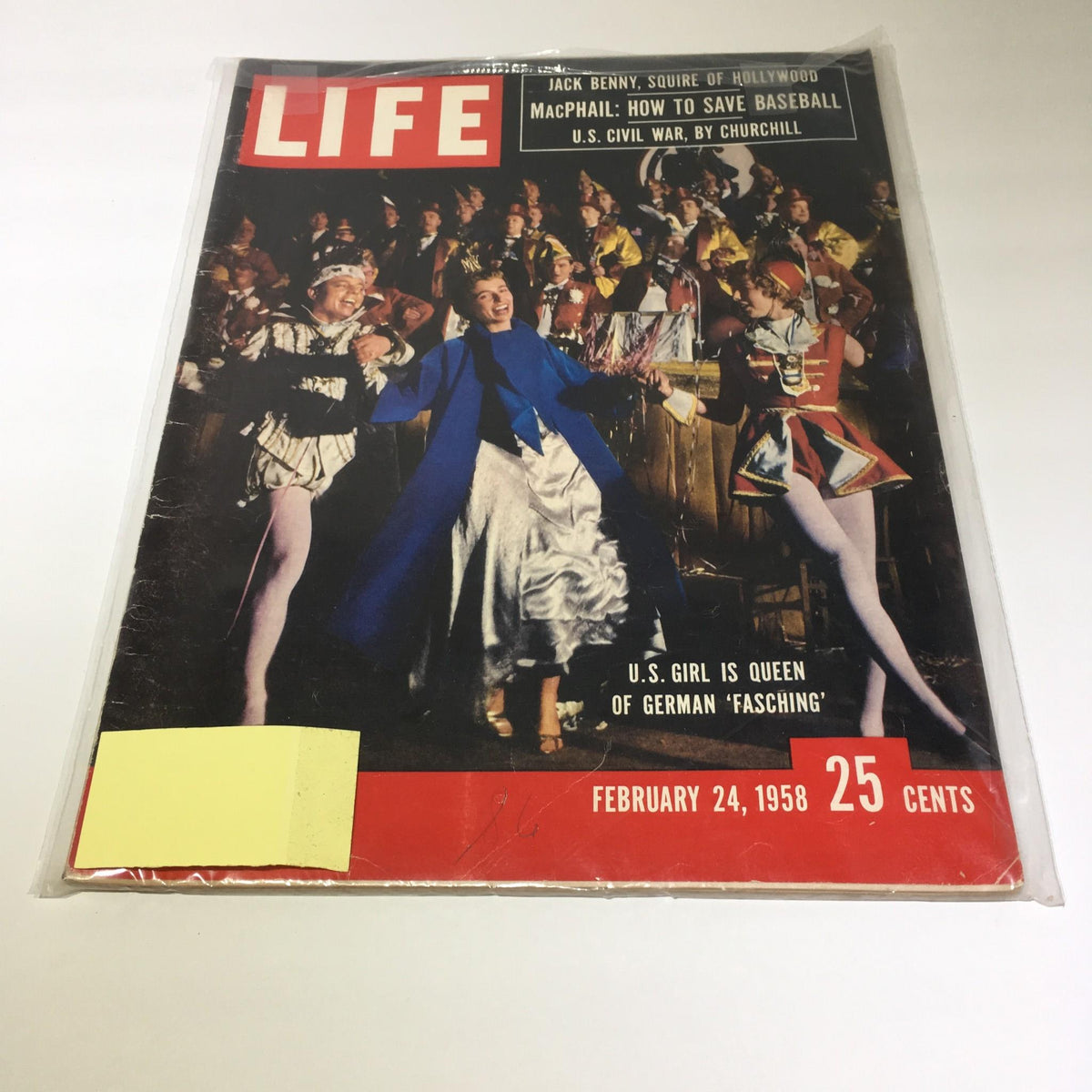 Cover of VTG Life Magazine from February 24, 1958 featuring an American girl crowned as queen of German fashion during the Fasching festival, showcasing vibrant costumes and cultural celebration.