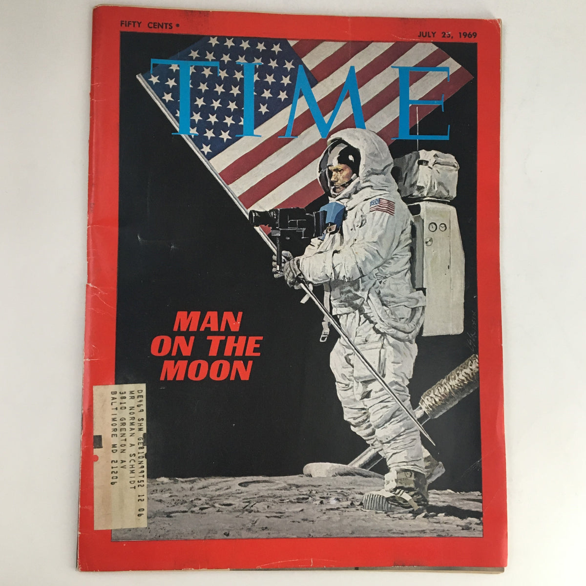Time Magazine July 25, 1969 cover featuring an astronaut on the Moon with an American flag, highlighting Neil Armstrong's historic achievement as the first man to walk on the Moon.
