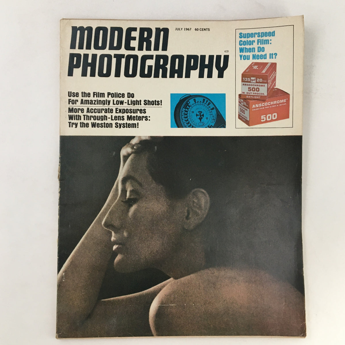 Cover of Modern Photography Magazine July 1967 featuring an article on Through-Lens Meters and a striking photograph of a woman's profile.