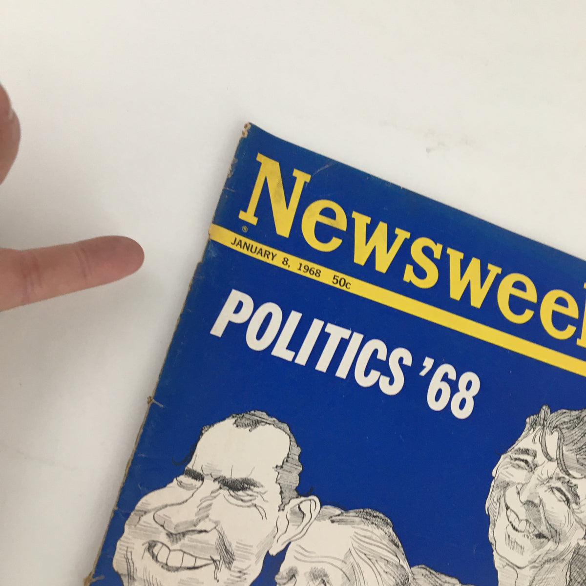 Close-up of Newsweek Magazine January 8 1968 showing the title 'Politics'68' with illustrations of political figures including Richard Nixon. Emphasizes the magazine's vintage condition.