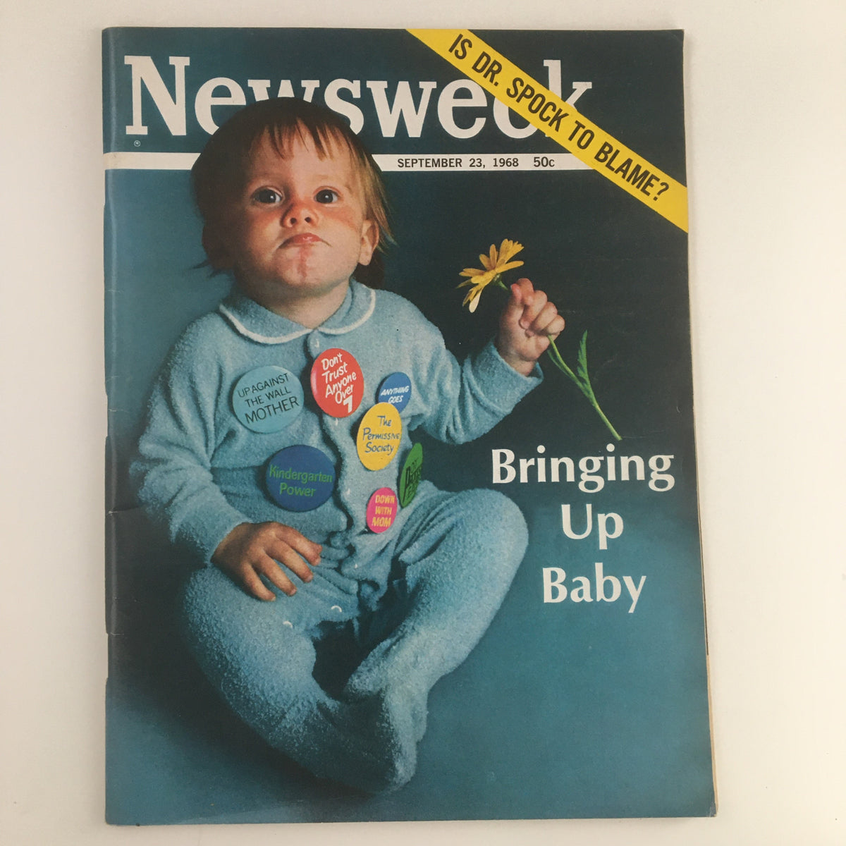 Newsweek Magazine cover from September 23, 1968 featuring a young child holding a flower and wearing a blue outfit, with headlines discussing Dr. Spock in 'Bringing Up Baby'. The cover poses the question: 'Is Dr. Spock to blame?'