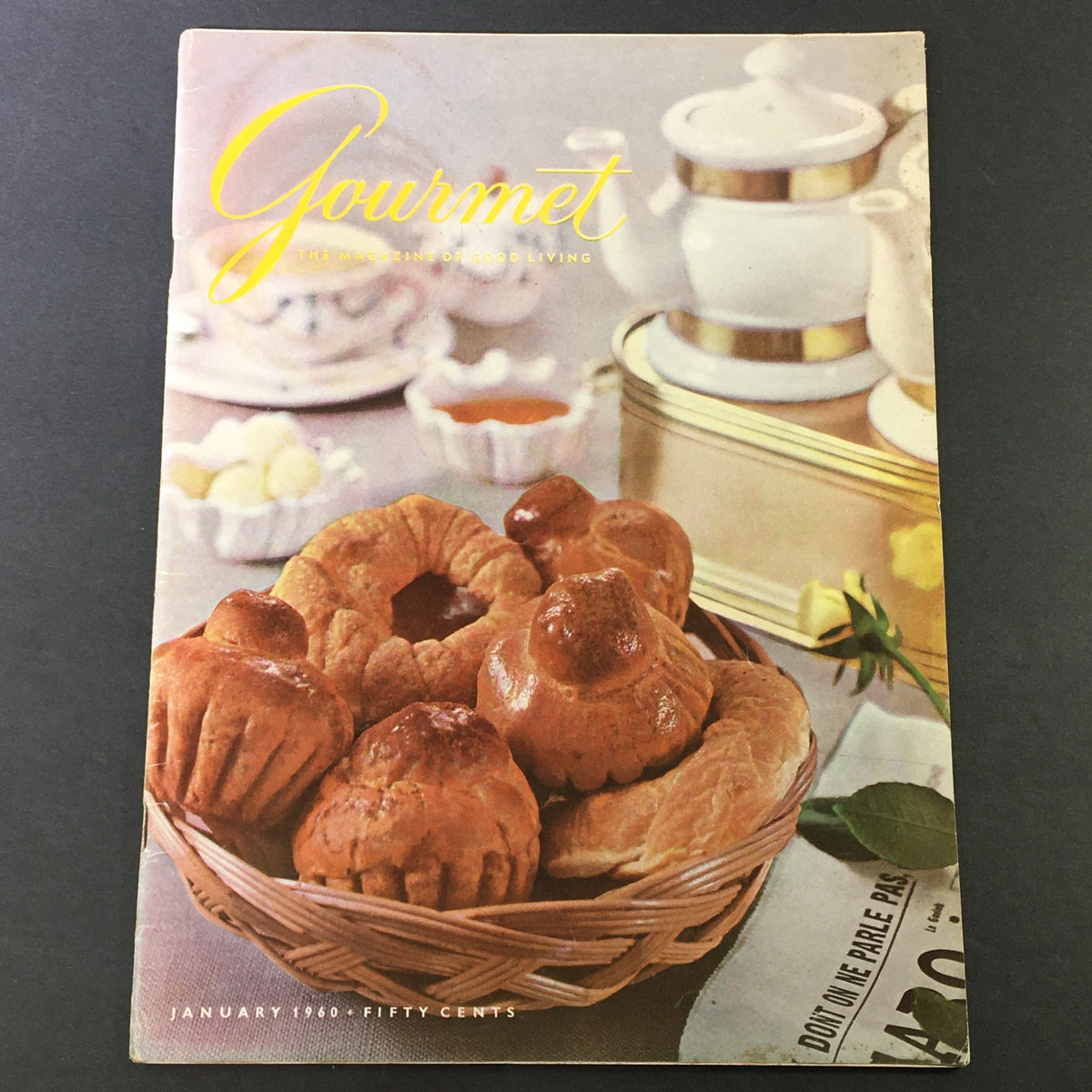 Cover of VTG Gourmet, The Magazine of Good Living January 1960, featuring a basket of baked goods, emphasizing culinary delights and vintage charm.