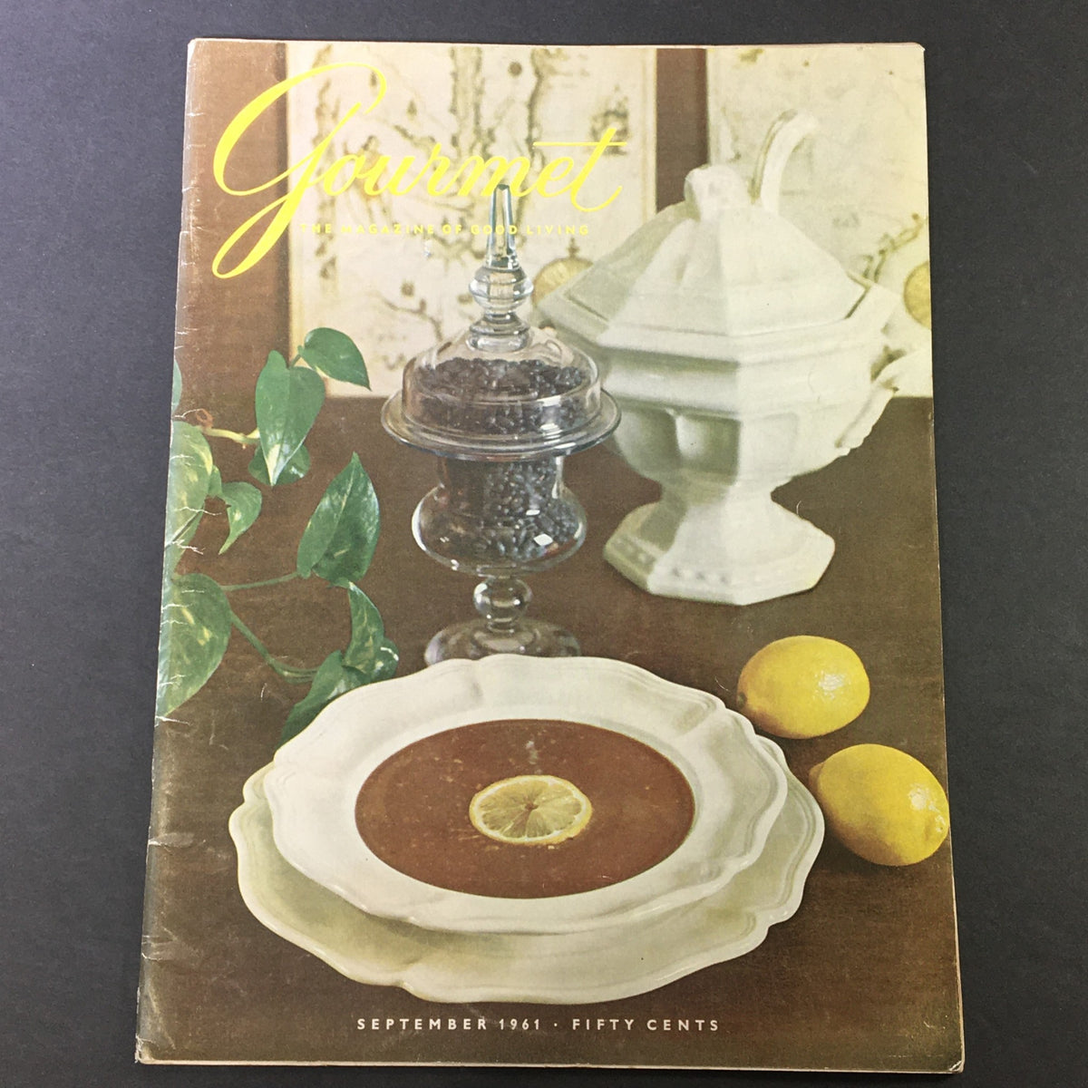Cover of VTG Gourmet: The Magazine of Good Living September 1961 - Guests of the Grandee featuring a dessert plate with a lemon slice and elegant tableware.