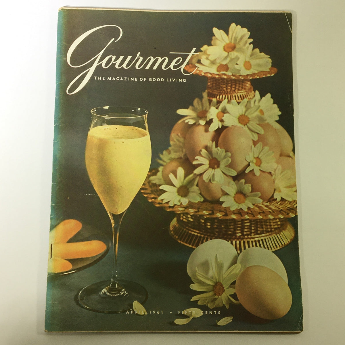 VTG Gourmet The Magazine of Good Living April 1961 cover featuring a glass of dessert drink, decorative eggs, and flowers, highlighting the beauty of Surrey.