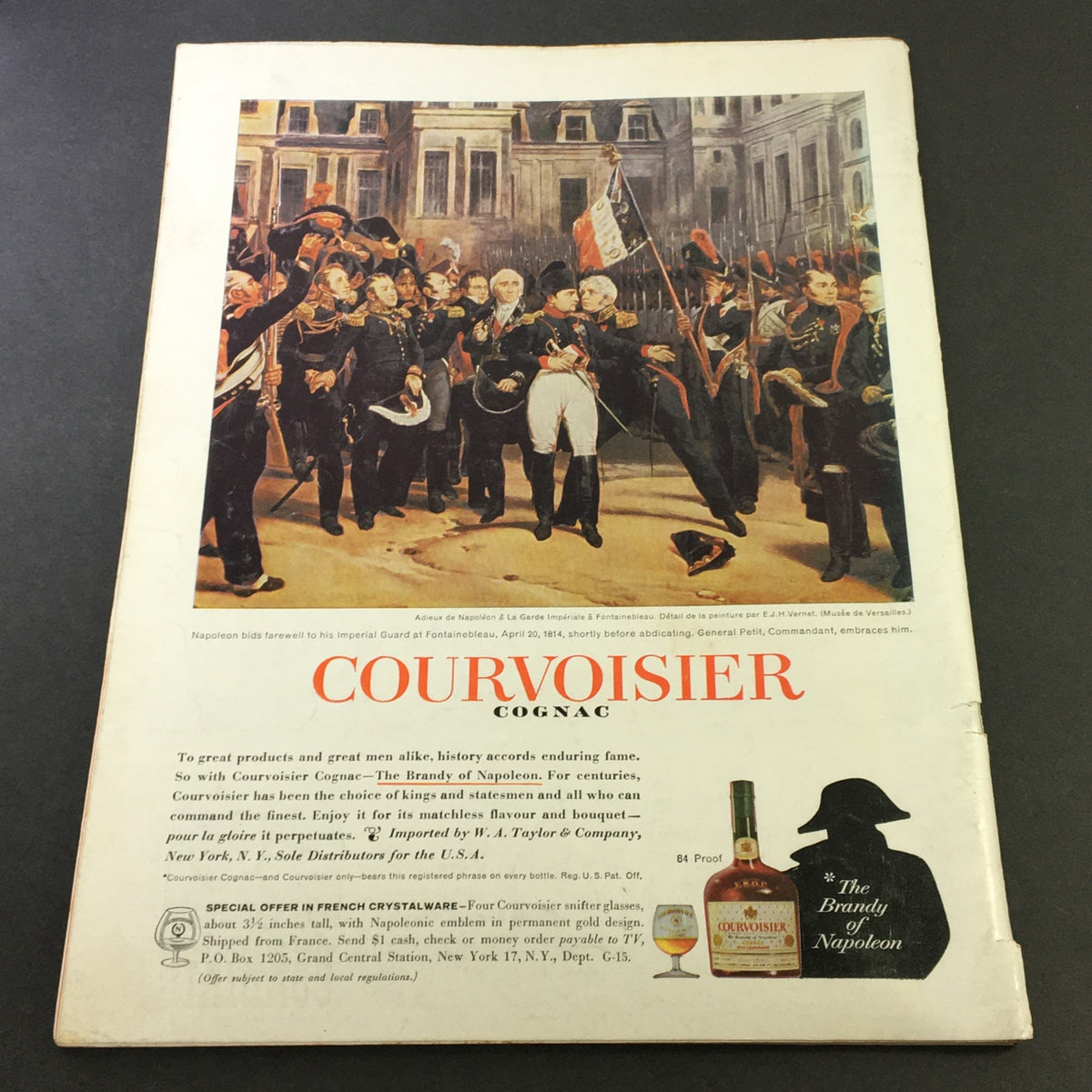 Back cover of VTG Gourmet Magazine December 1961 featuring an advertisement for Courvoisier Cognac, capturing a historical scene.