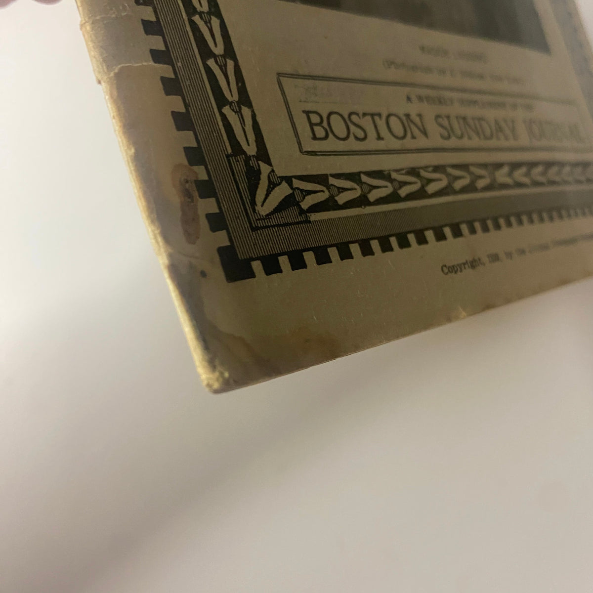 Close-up view of the corner of The New England Home Magazine dated August 6, 1899, displaying typical light wear and tear, indicating its vintage condition.