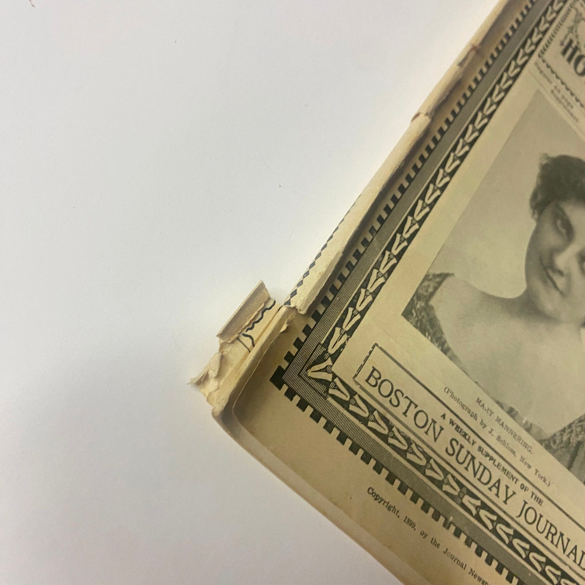 Detail of The New England Home Magazine, August 13, 1899, showing the magazine's cover edge with a slight tear.