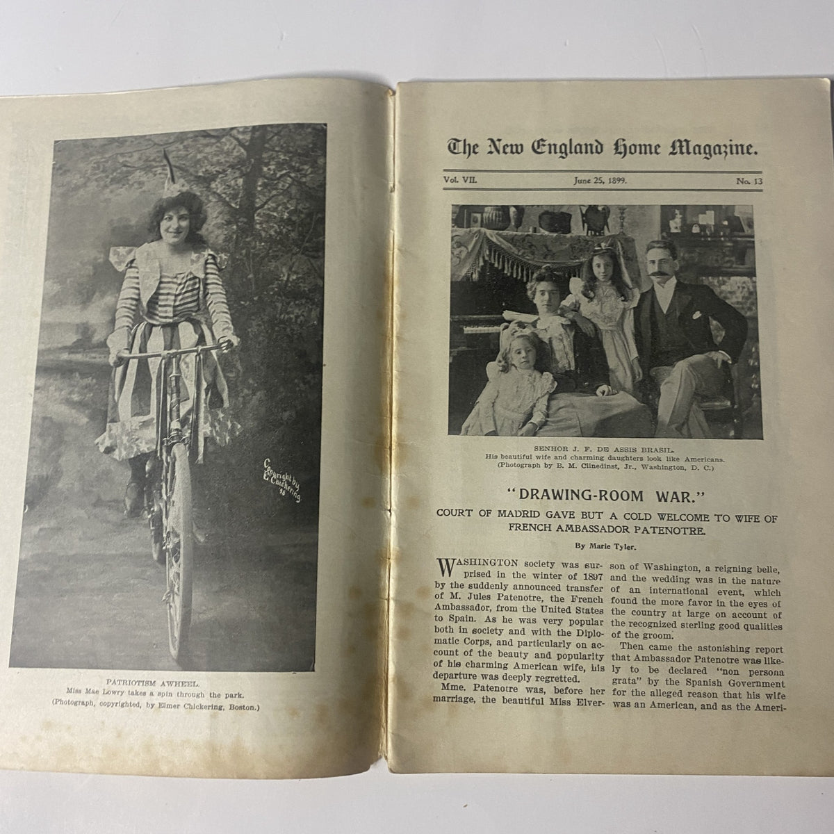 The New England Home Magazine June 25, 1899 featuring a photograph of Miss Mae Lowry enjoying a patriotic bicycle ride in the park, showcasing late-19th-century fashion and lifestyle.