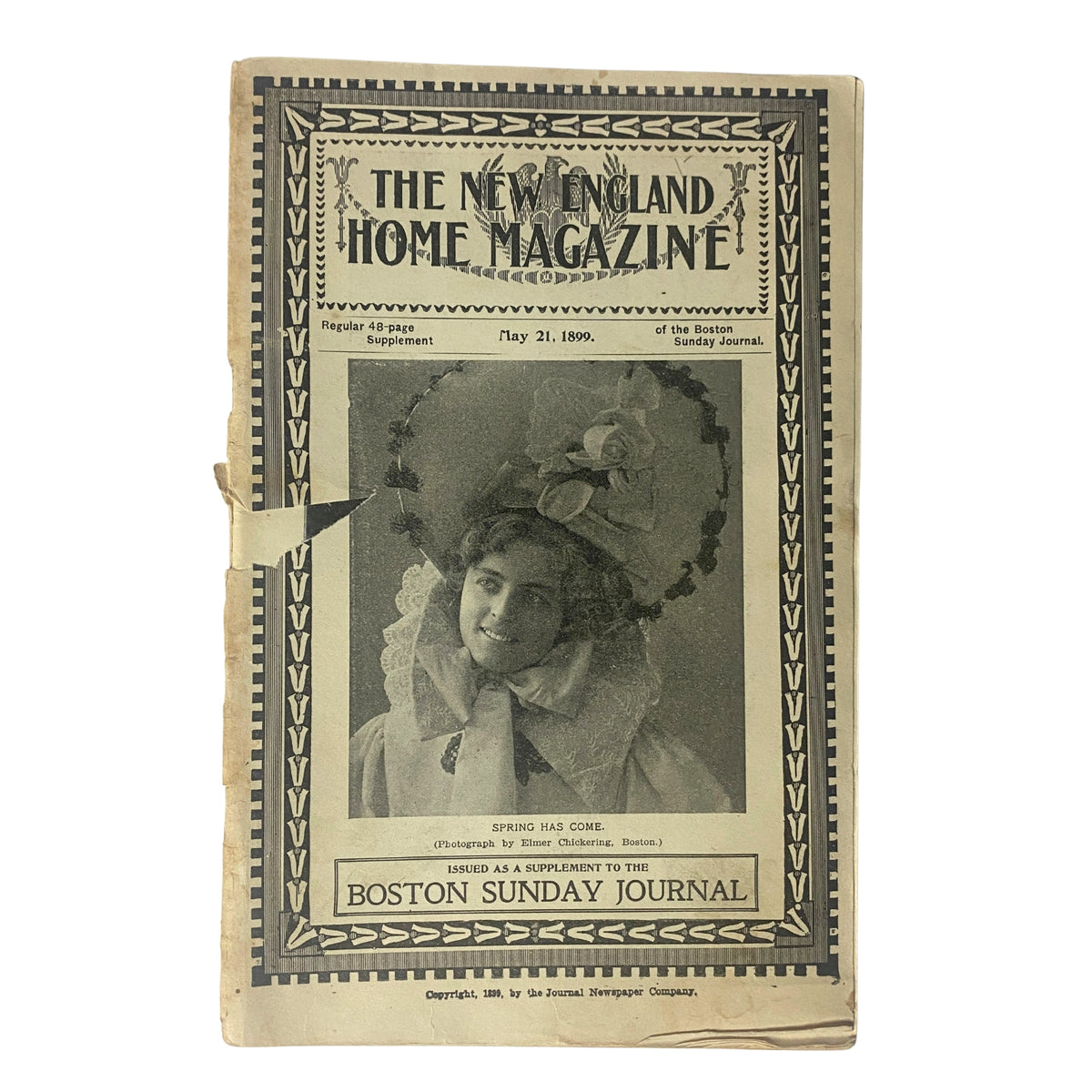 Cover of The New England Home Magazine, May 21, 1899, featuring a woman in a large hat and decorative lace collar, embodying the theme 'Spring Has Come'. This vintage magazine was published as a supplement to the Boston Sunday Journal.