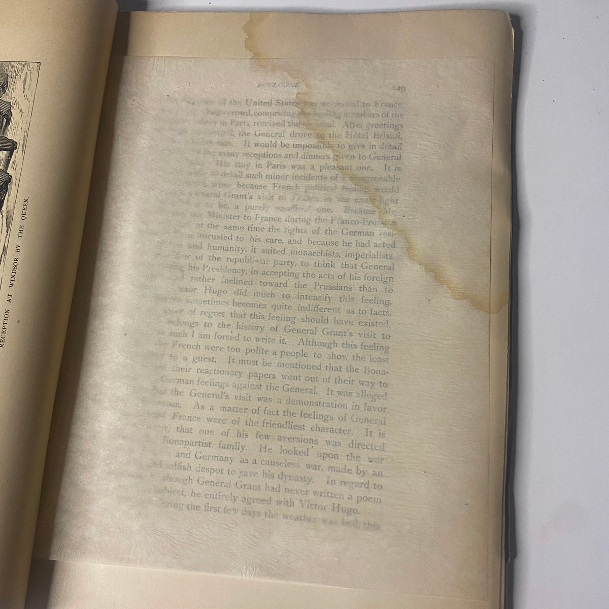 An interior page from 'Around the World with General Grant' by John Russell Young, showcasing a section with visible water damage and age-related wear, indicative of the book's vintage condition.
