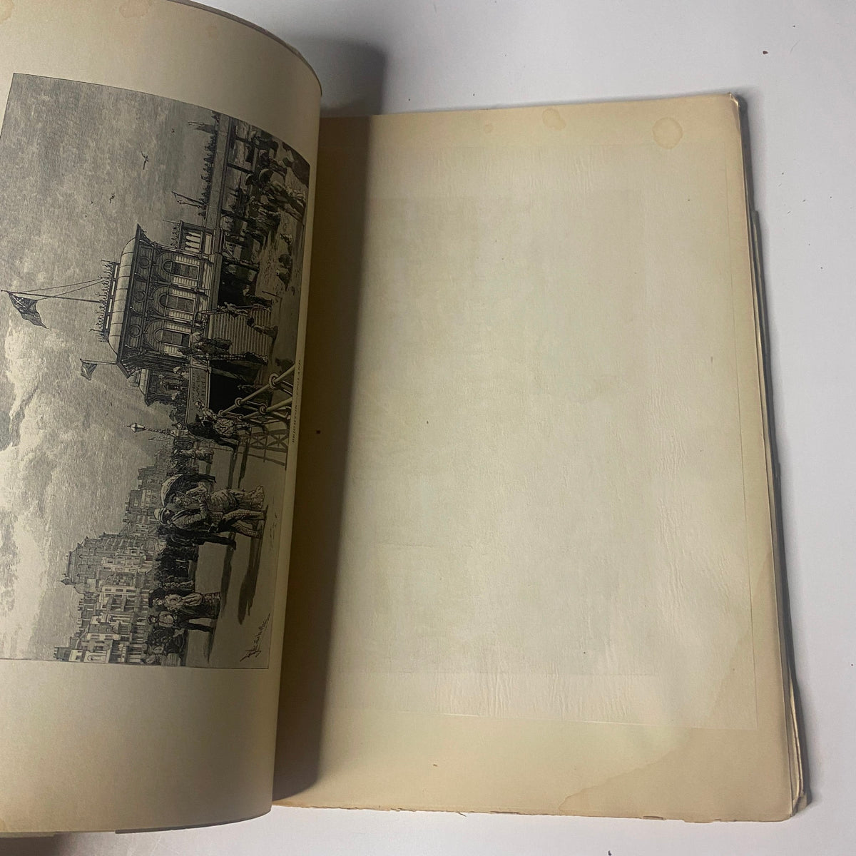 Interior view of 'Around the World with General Grant – Book by John Russell Young, Part Nine', displaying an open page with a blank layout, indicative of the book's archival condition.