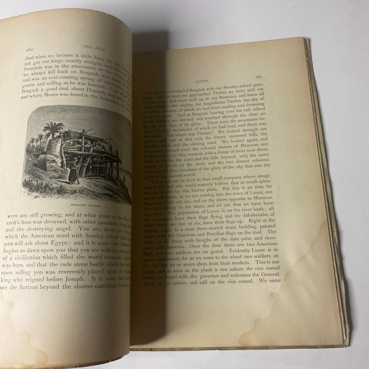Page from 'Around the World with General Grant' book by John Russell Young, featuring text and an illustration of a historical building, reflecting on the journey of General Grant in the 19th century.