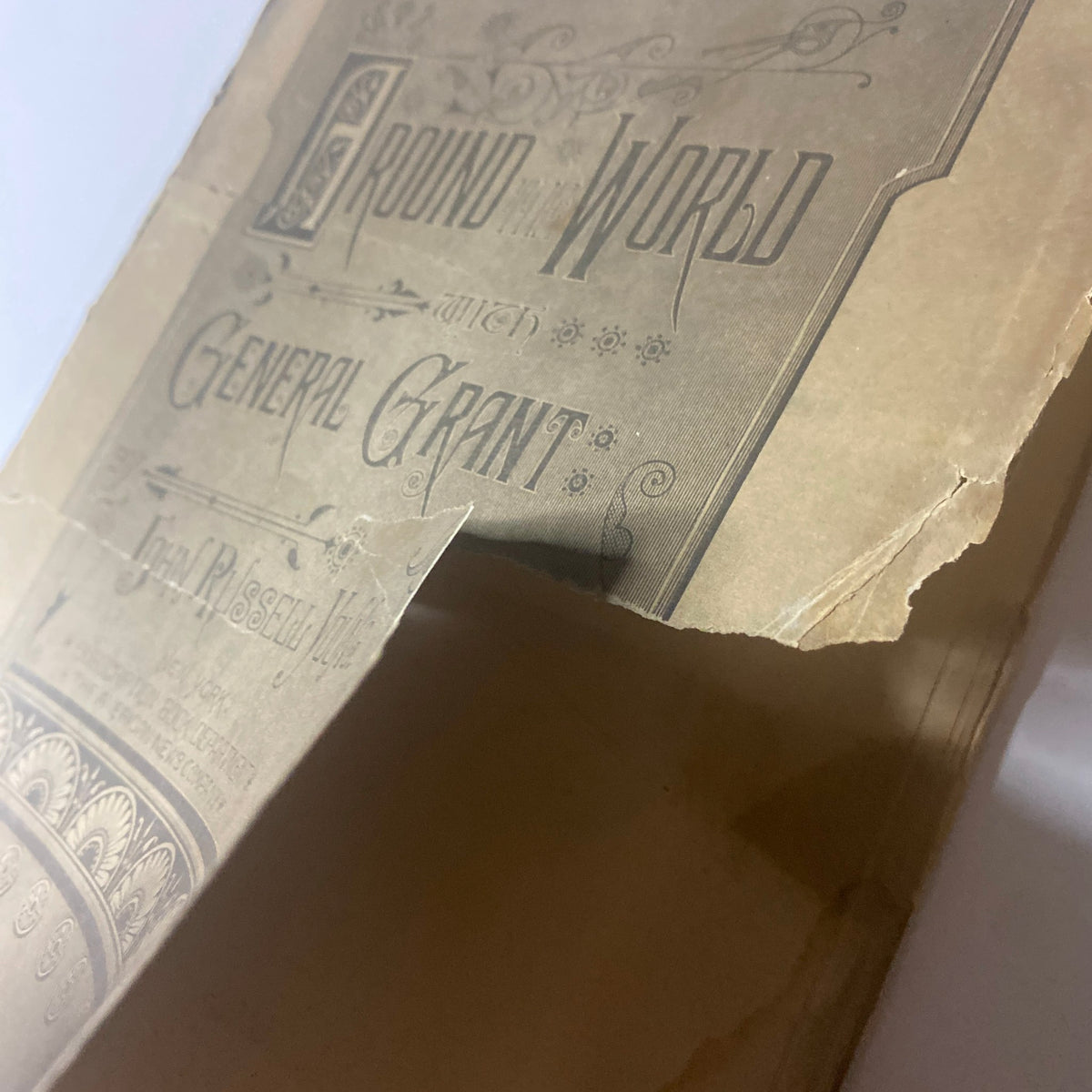 Cover of Around the World with General Grant Book by John Russell Young, showing signs of age and wear.