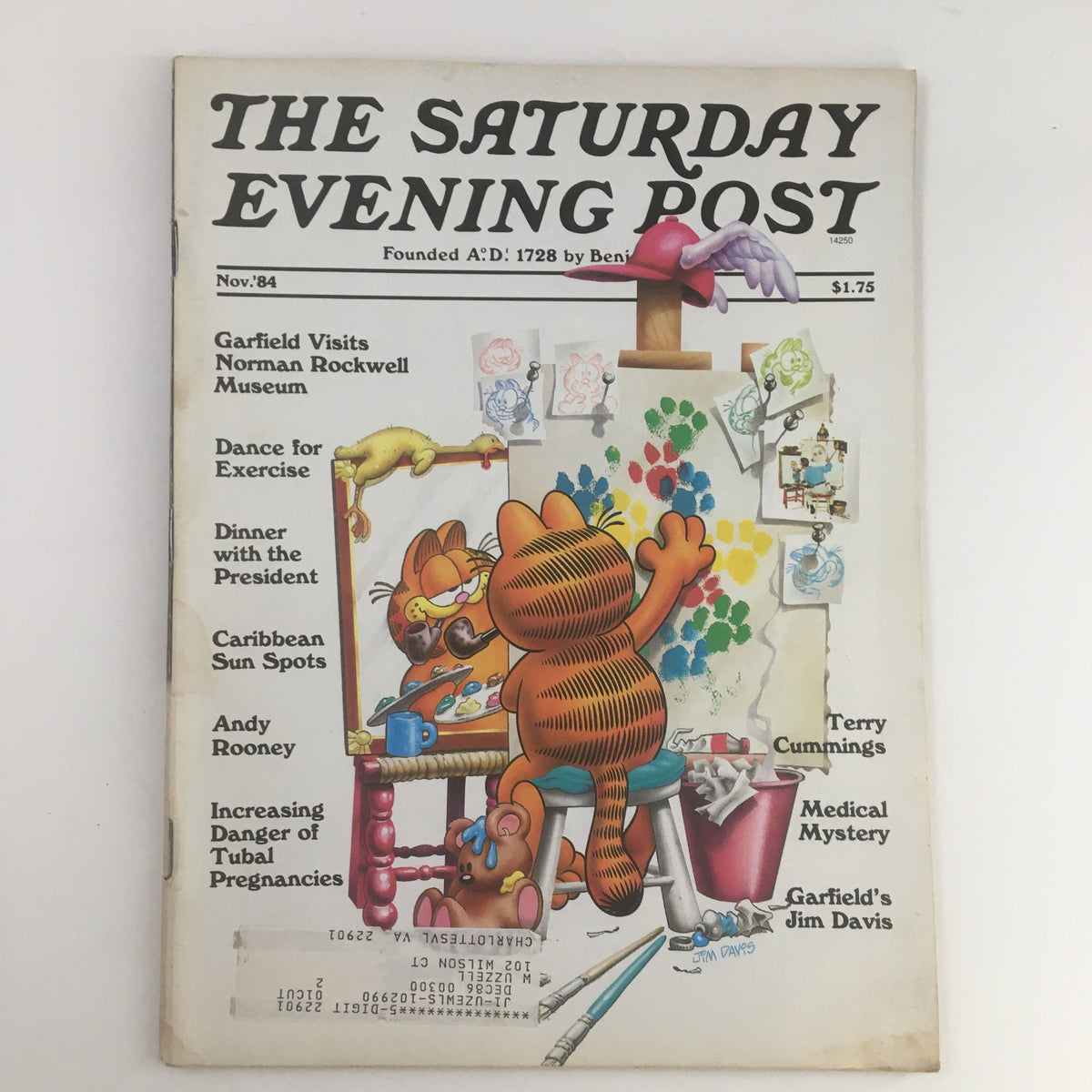 Cover of The Saturday Evening Post November 1984 featuring Garfield Visits Norman Rockwell Museum, showcasing Garfield with a paintbrush and palette, highlighting classic American art.