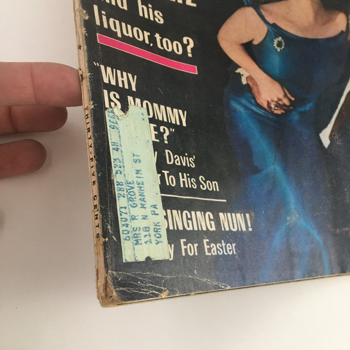 Close-up of the side of the Photoplay Magazine April 1964, revealing vintage address label and worn edges, emphasizing its collectible nature.