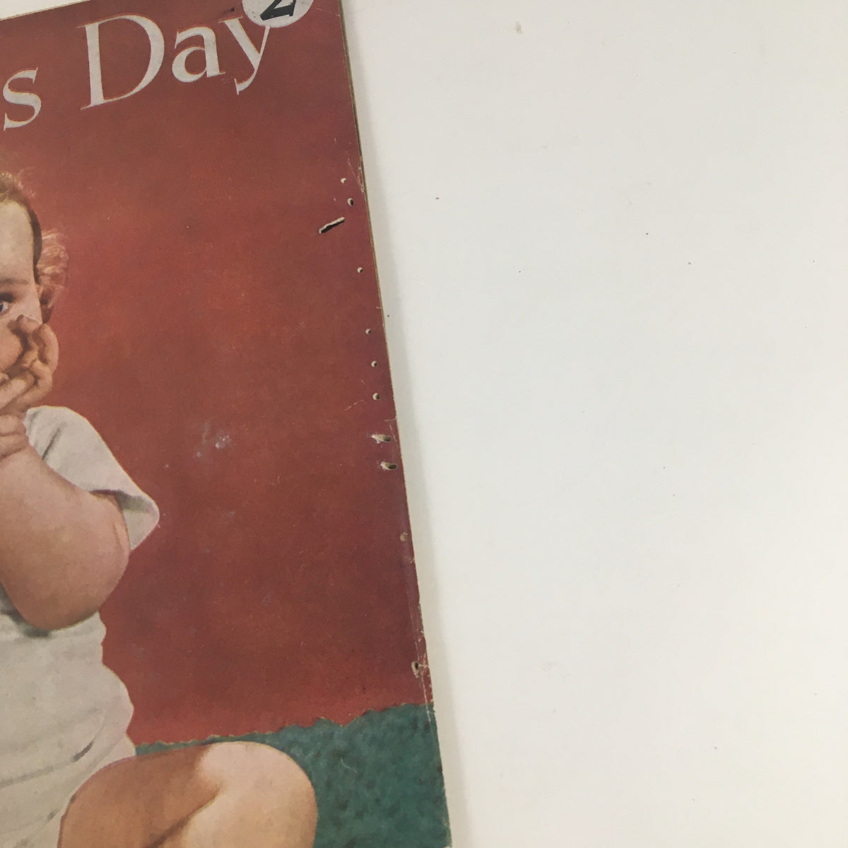 Close-up of the Woman's Day Magazine January 1946 cover showing a baby with a playful expression.