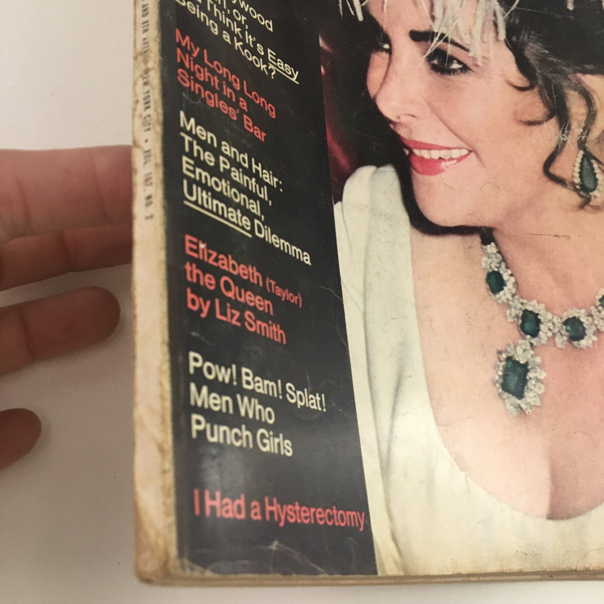 Side view of Cosmopolitan Magazine August 1969 with Beautiful Elizabeth Taylor on the cover, highlighting the magazine's vintage charm and iconic fashion.