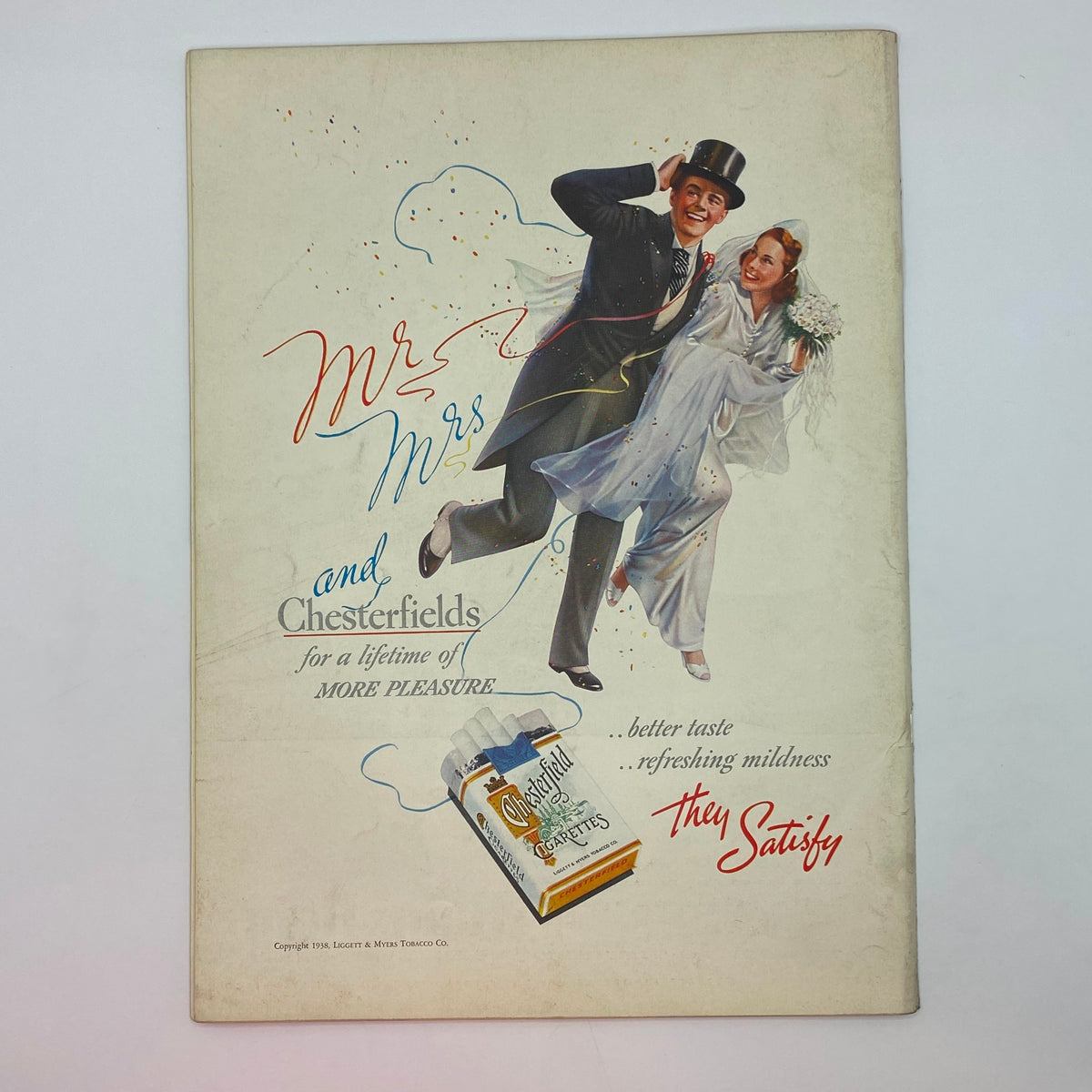 A vintage advertisement from The New Yorker magazine dated May 28, 1938, featuring a couple celebrating a wedding, with the text 'Mr. Mrs. and Chesterfields for a lifetime of MORE PLEASURE,' promoting Chesterfield cigarettes. This image complements the Victor Bobritsky cover in very good condition.