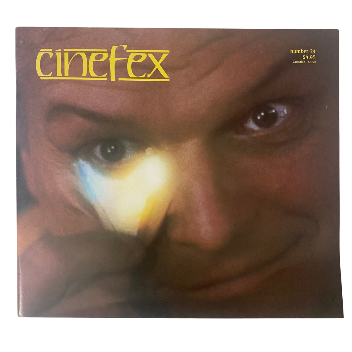 Cinefex Magazine November 1985 No. 24 featuring a close-up of a man emphasizing the magic of movie effects. Vintage publication in very good condition.